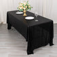 Shiny black polyester tablecloth with shimmer sequin dots on a dining table.