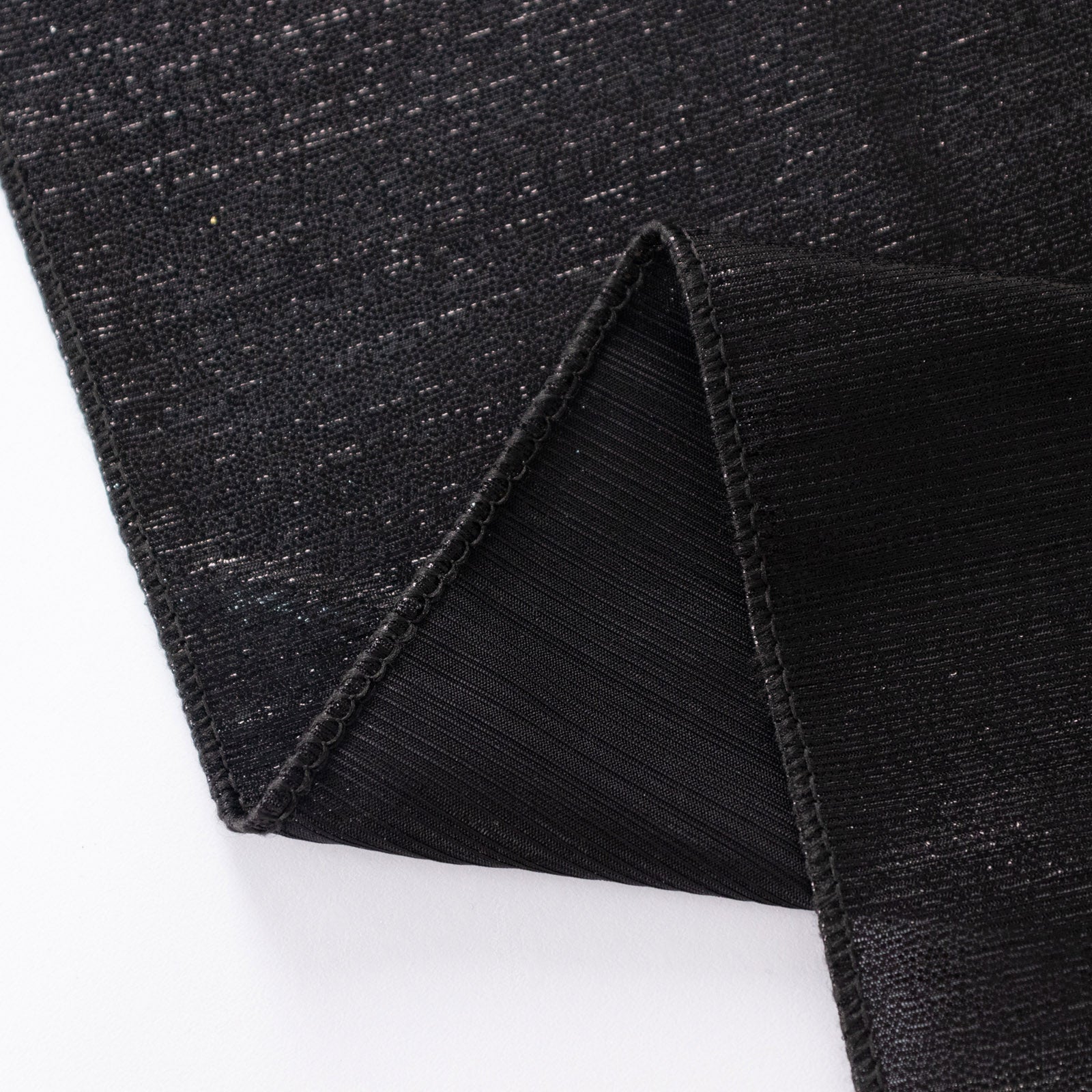 Shiny black polyester tablecloth with shimmer sequin dots.