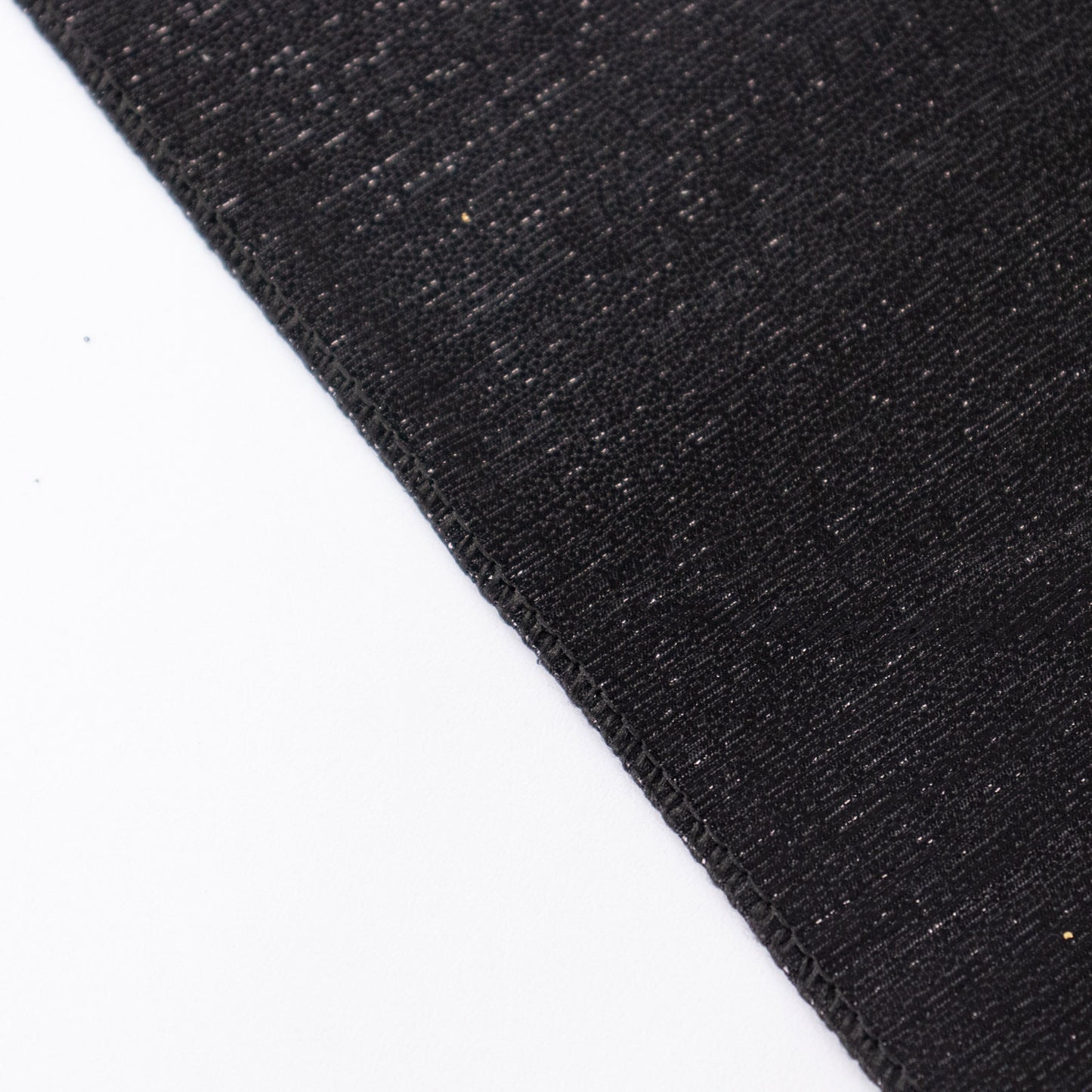 Shiny black rectangular tablecloth with shimmer sequin dots.