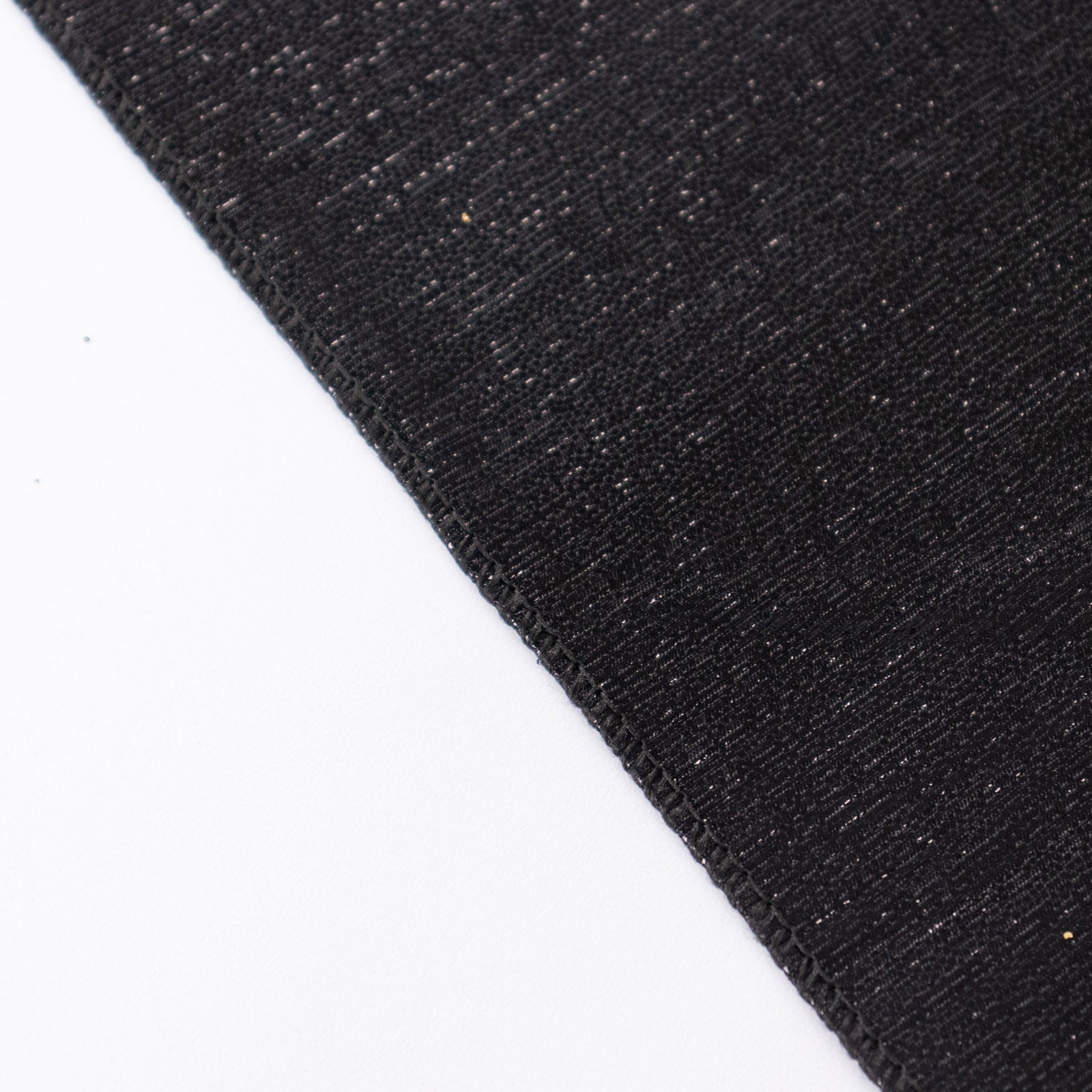 Shiny black rectangular tablecloth with shimmer sequin dots.