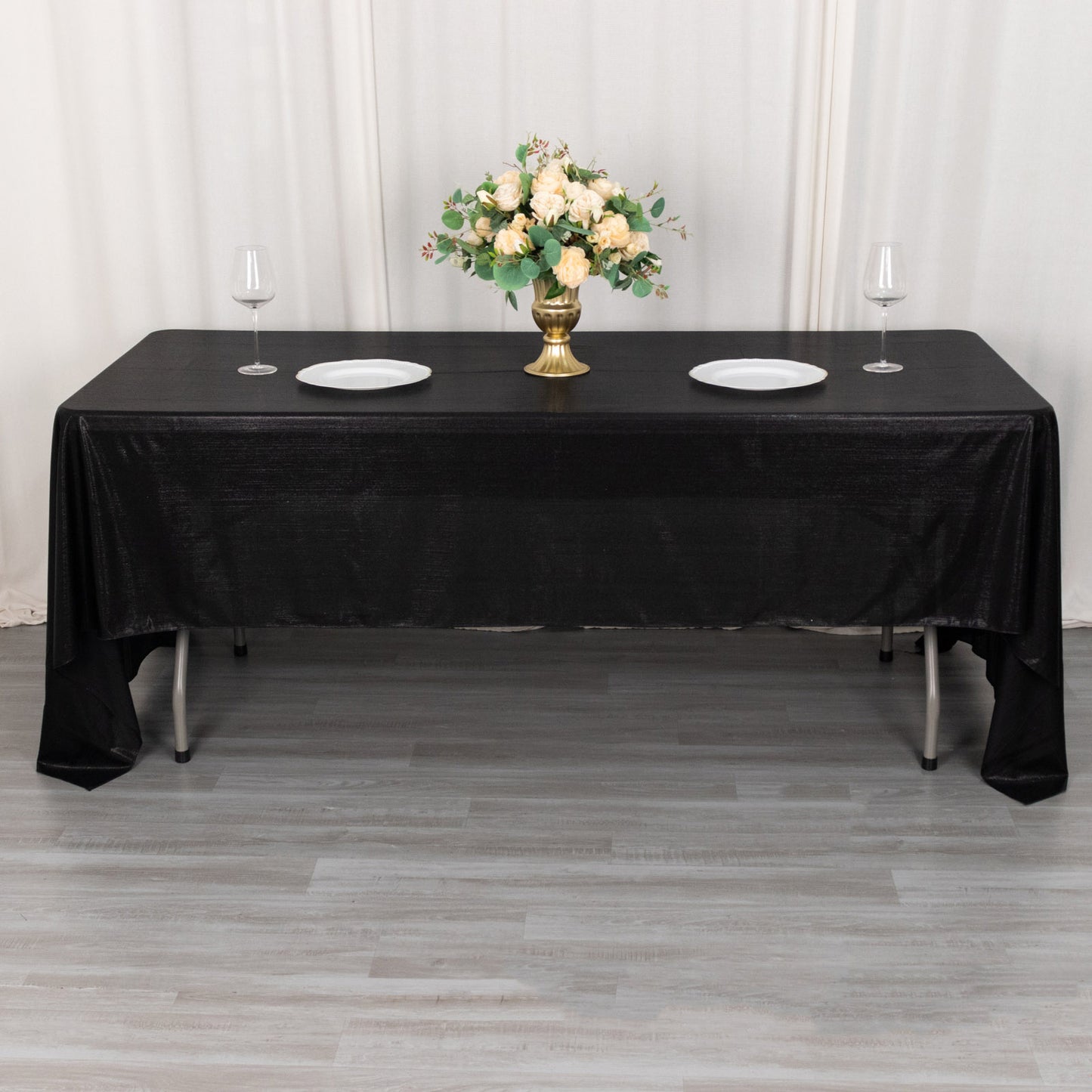 Shiny black polyester rectangular tablecloth with shimmer sequin dots.