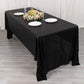 Shiny black polyester rectangular tablecloth with shimmer sequin dots.