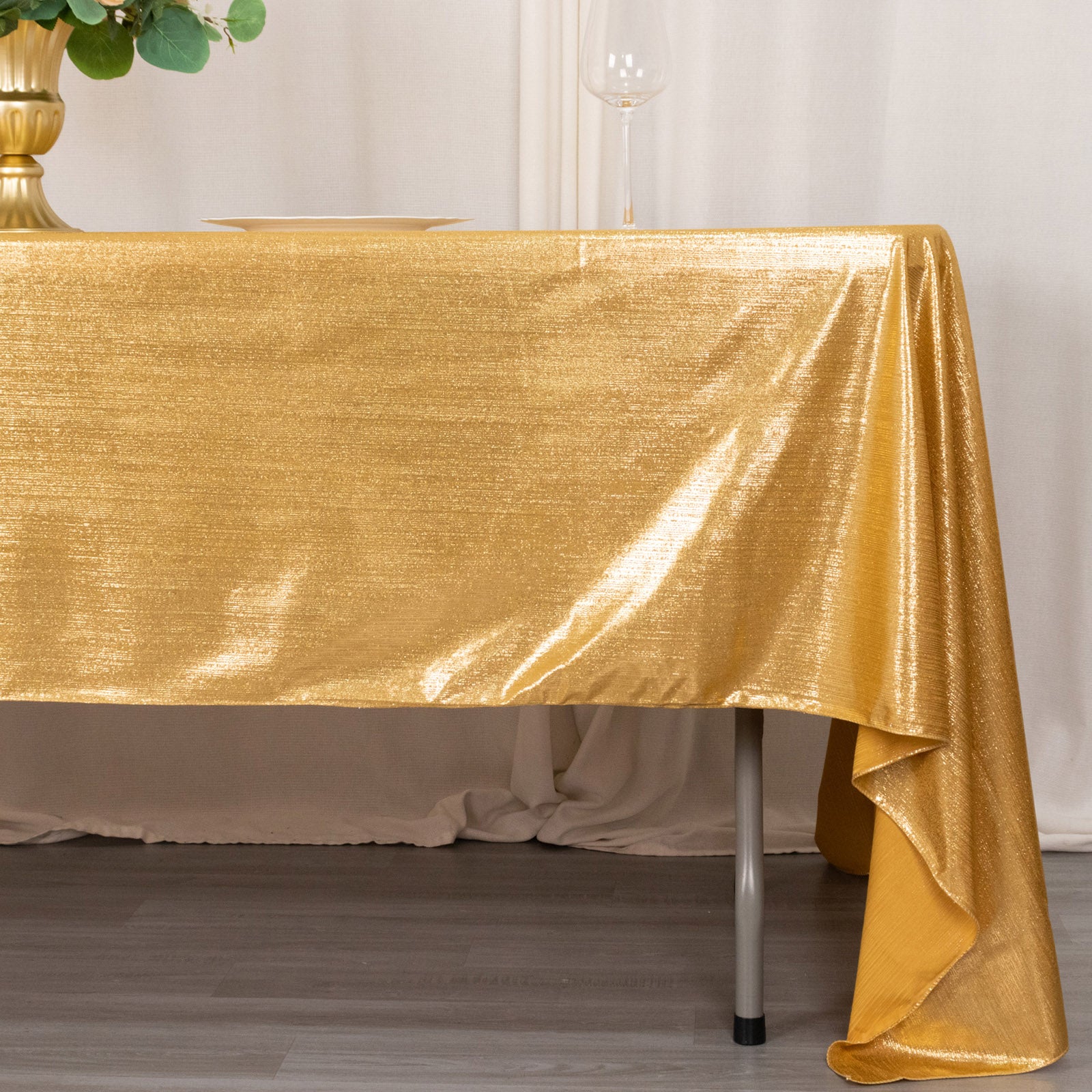 Shiny gold rectangular tablecloth with shimmer sequin dots.