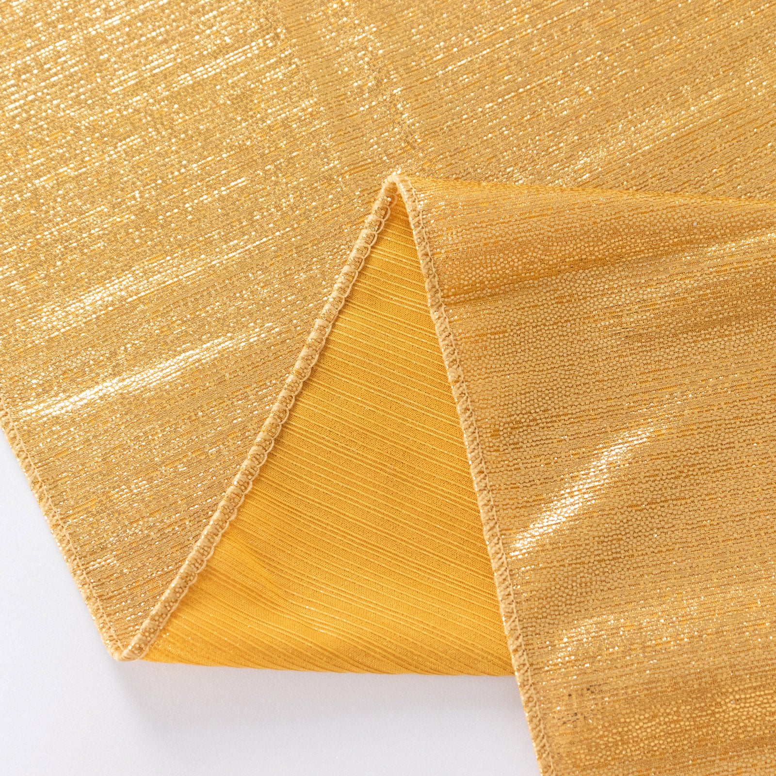 Shiny gold rectangular tablecloth with shimmer sequin dots.