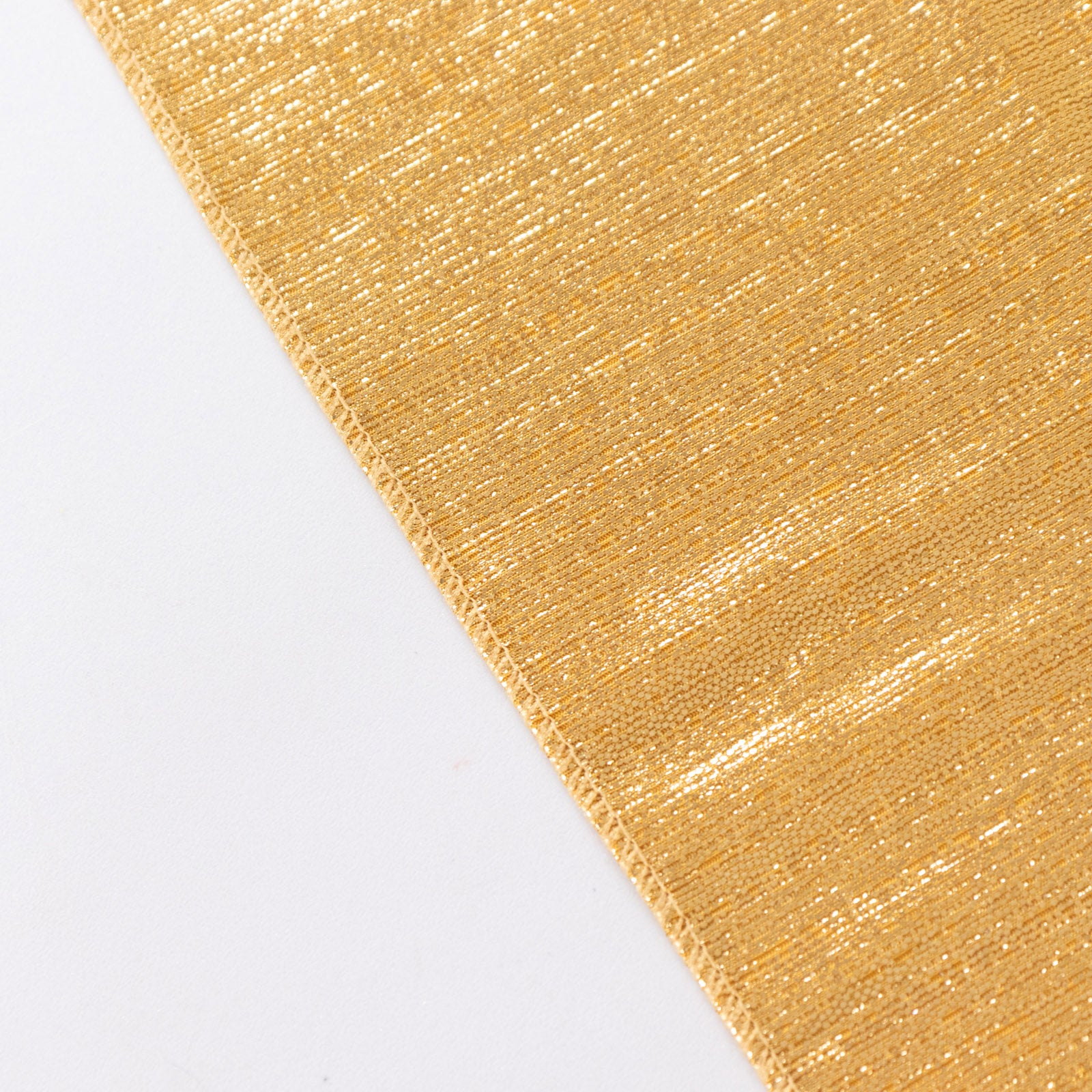 Shiny gold rectangular tablecloth with shimmer sequin dots.