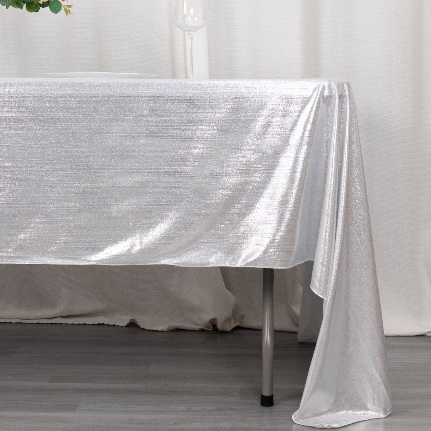 Shiny silver rectangular tablecloth with shimmer sequin dots.