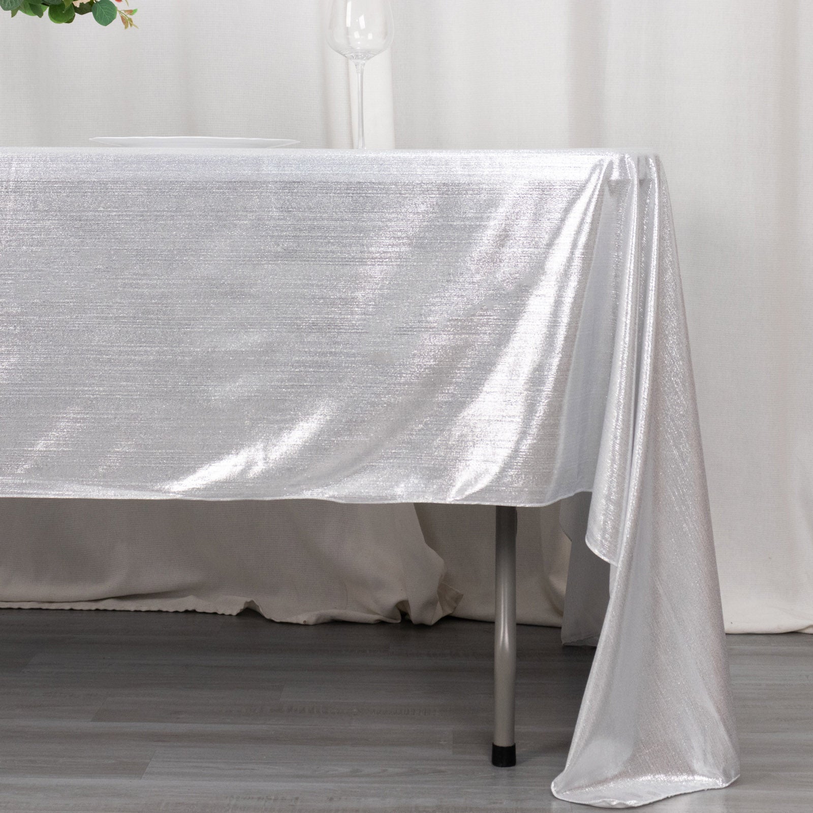 Shiny silver rectangular tablecloth with shimmer sequin dots.