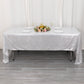 Shiny silver rectangular tablecloth with shimmer sequin dots on a dining table.