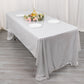 Shiny silver rectangular tablecloth with shimmer sequin dots on a dining table.