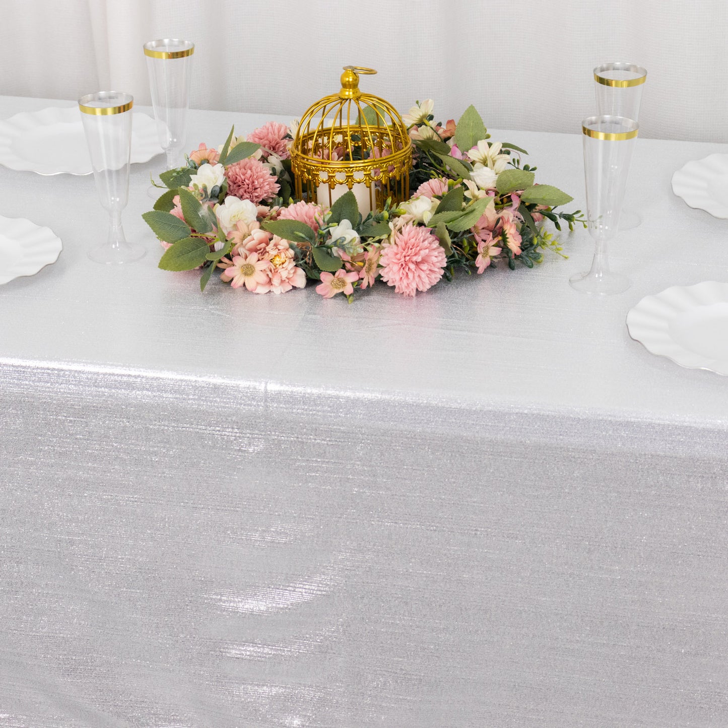 Shiny silver rectangular tablecloth with shimmer sequin dots.
