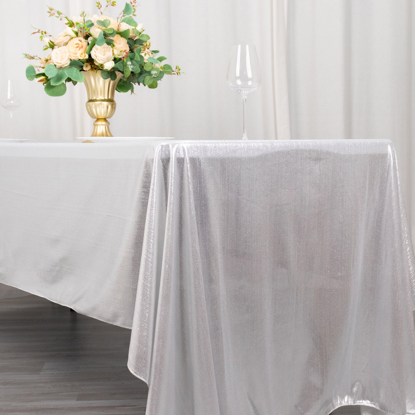 Shiny silver rectangular tablecloth with shimmer sequin dots.