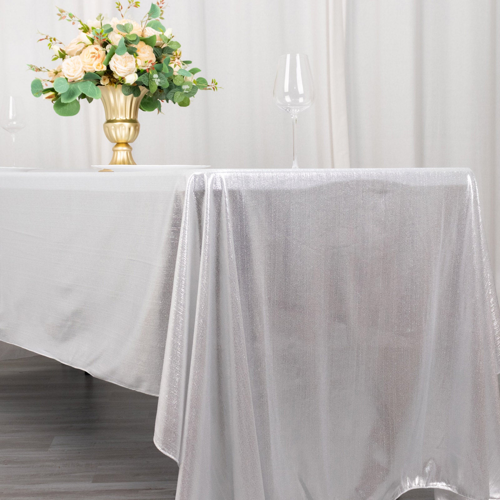 Shiny silver rectangular tablecloth with shimmer sequin dots.