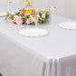 Shiny silver rectangular tablecloth with shimmer sequin dots on a dining table.