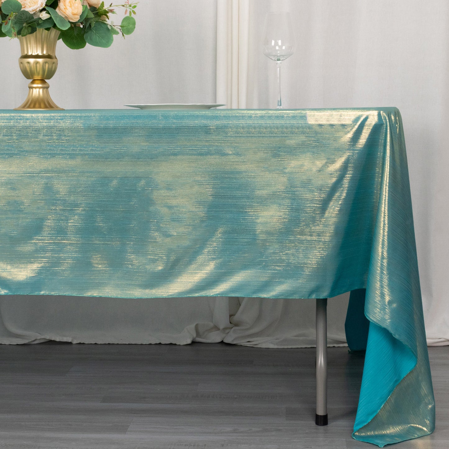 Shiny turquoise rectangular tablecloth with shimmer sequin dots.