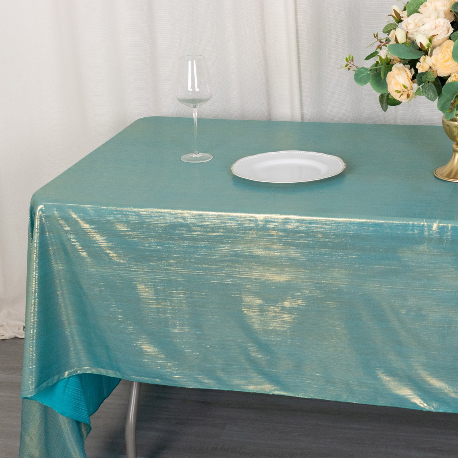 Shiny turquoise rectangular tablecloth with shimmer sequin dots.