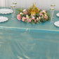 Shiny turquoise tablecloth with shimmer sequin dots on a decorated table.