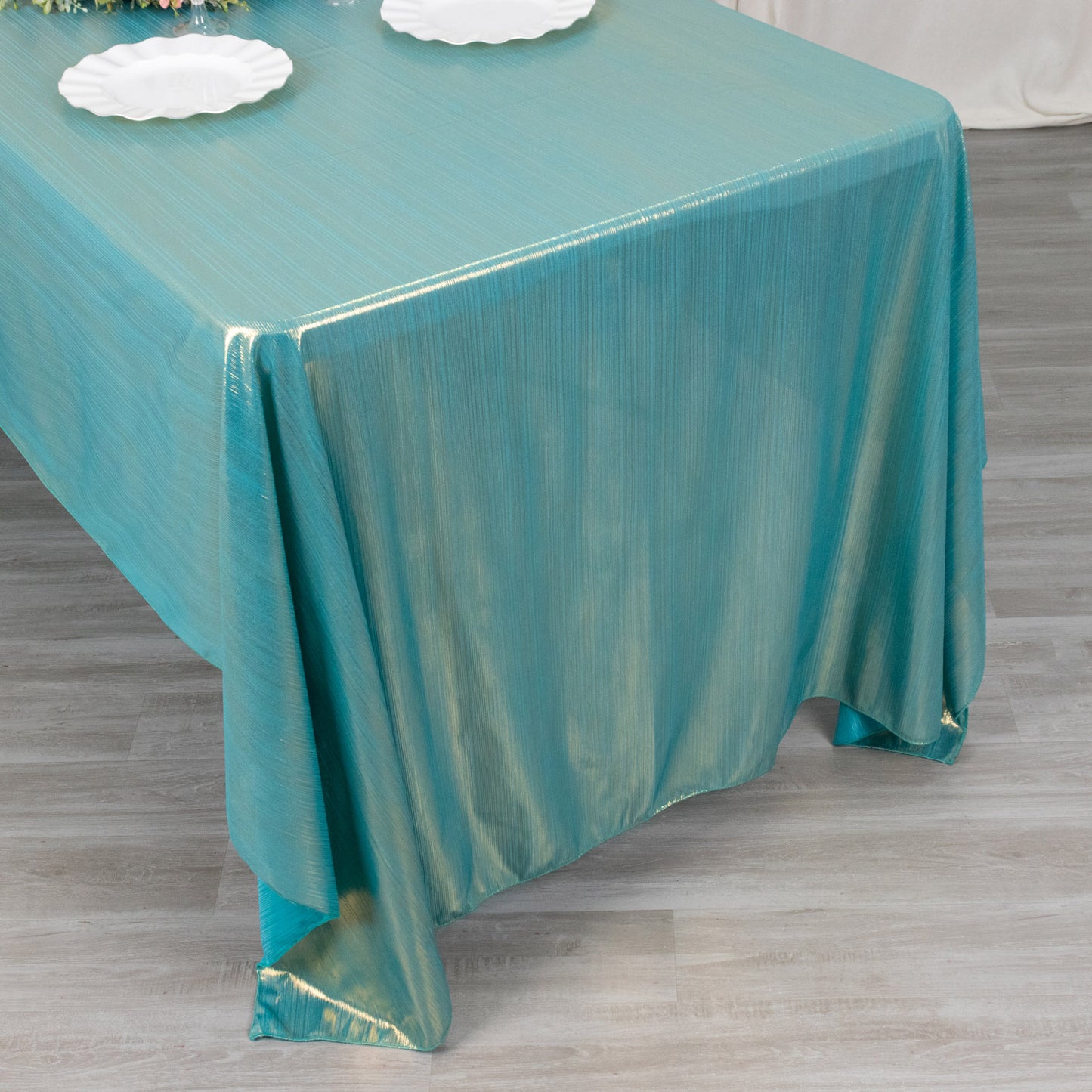 Shiny turquoise rectangular tablecloth with shimmer sequin dots.