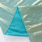 Shiny turquoise polyester tablecloth with shimmer sequin dots.