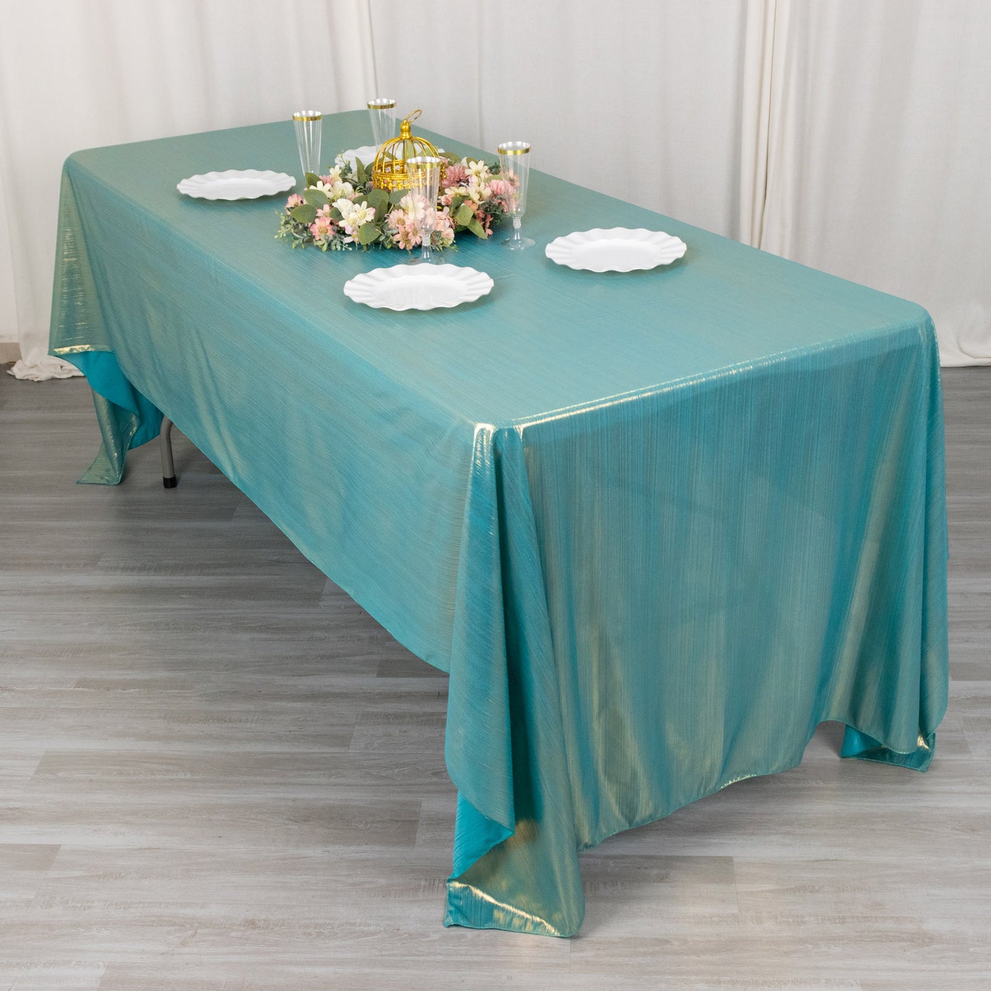 Shiny turquoise rectangular tablecloth with shimmer sequin dots.