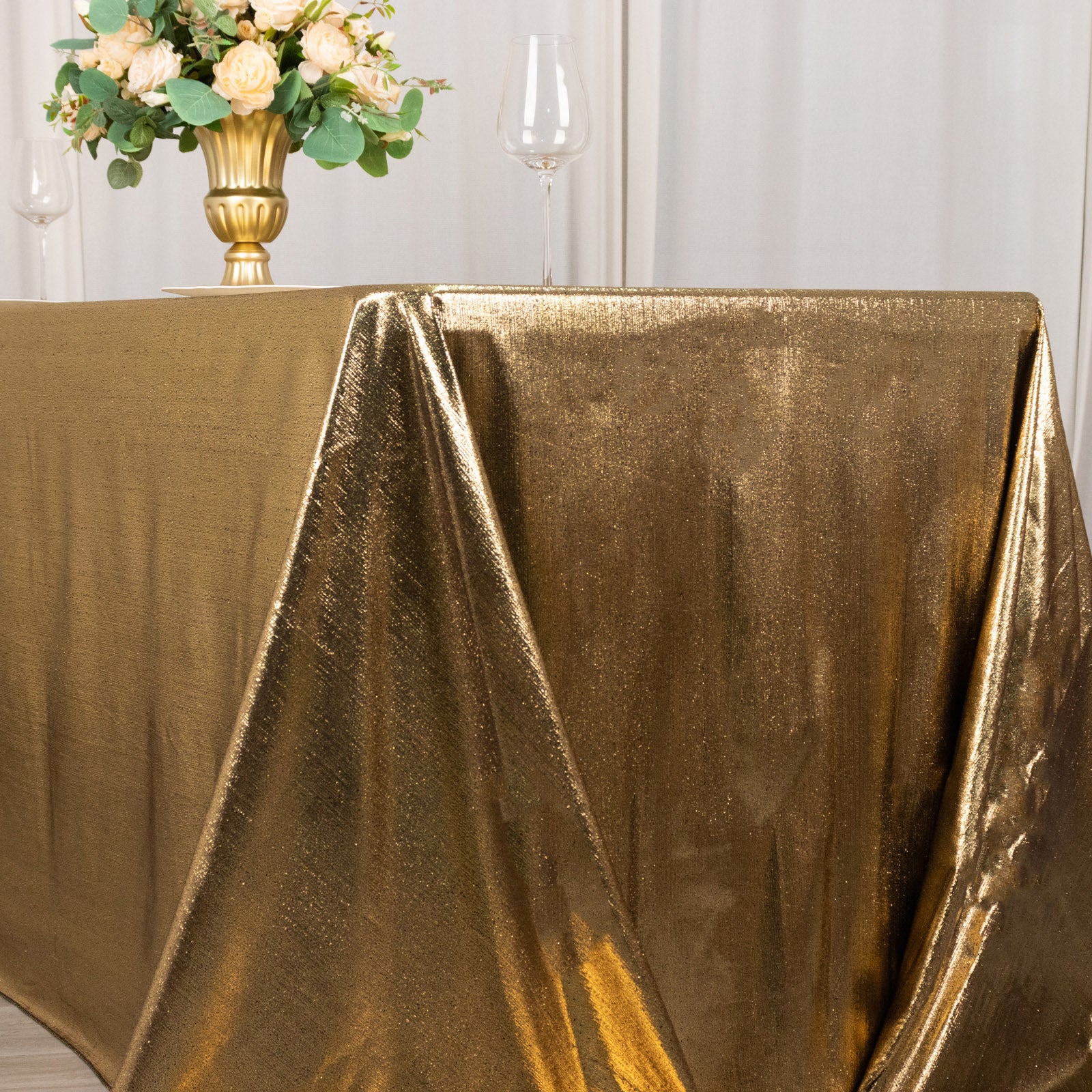 Antique gold shimmer sequin tablecloth with a sparkling glitter finish.