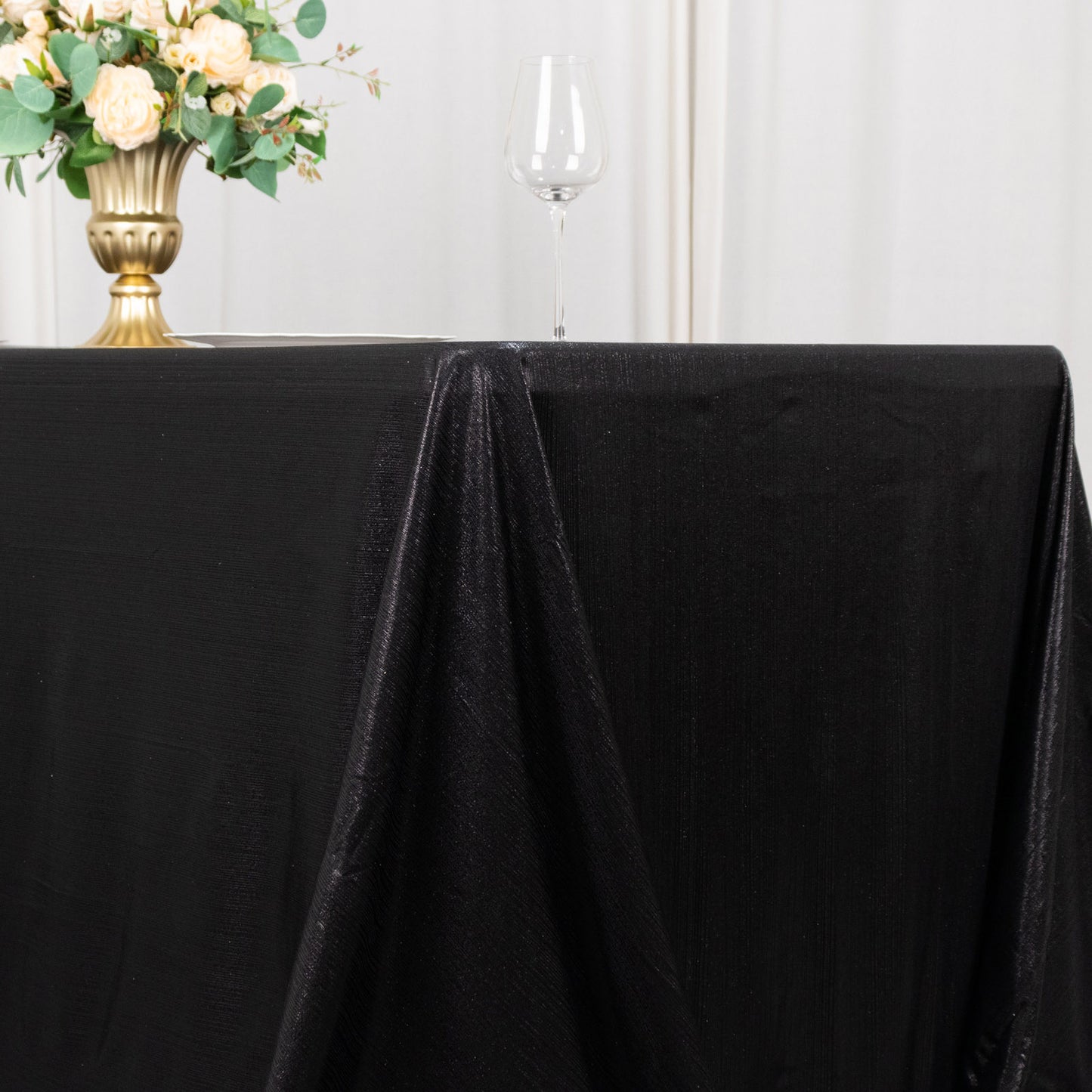Black shimmer sequin dots tablecloth for elegant events.