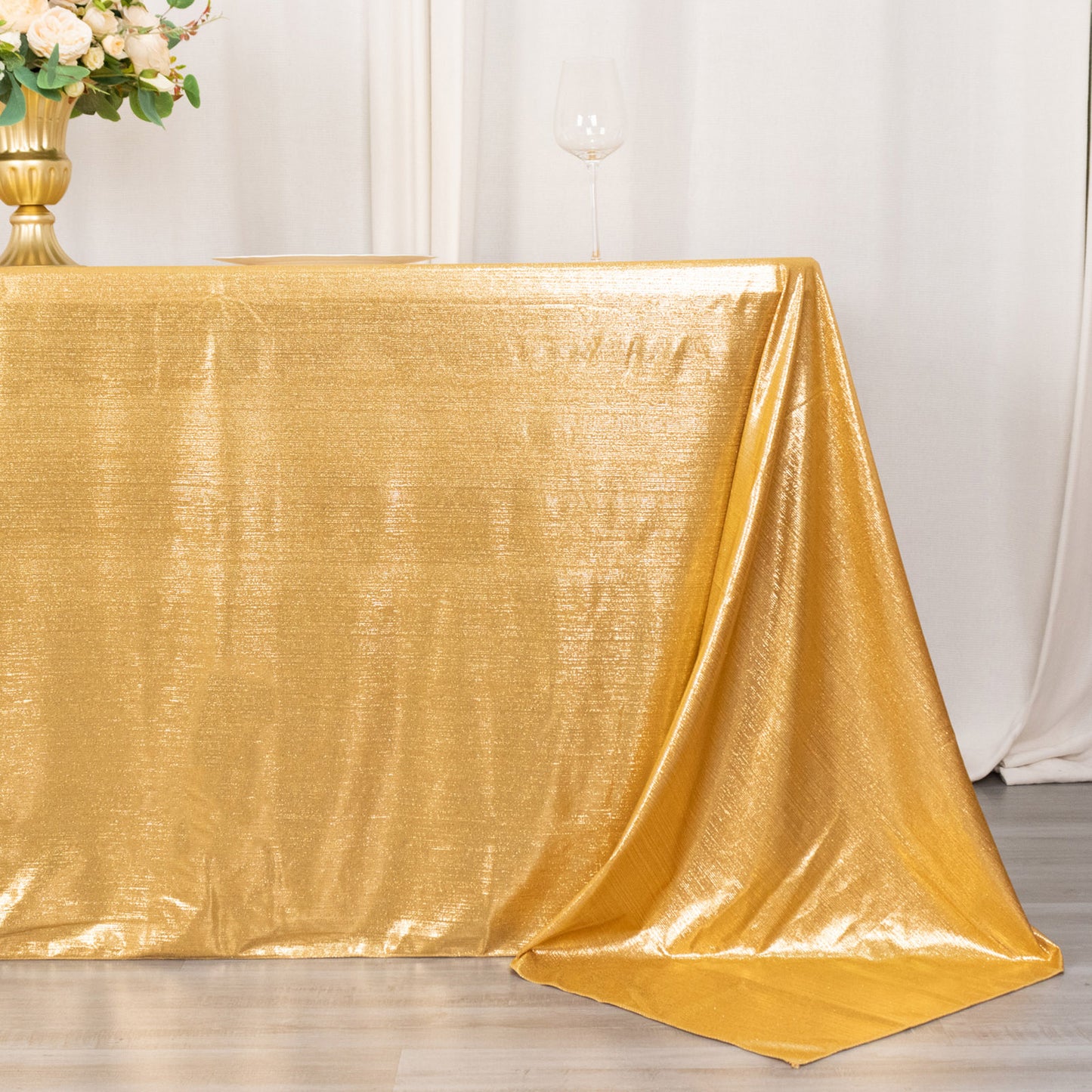 Gold shimmer sequin tablecloth, 90"x132", wrinkle-free sparkle design.