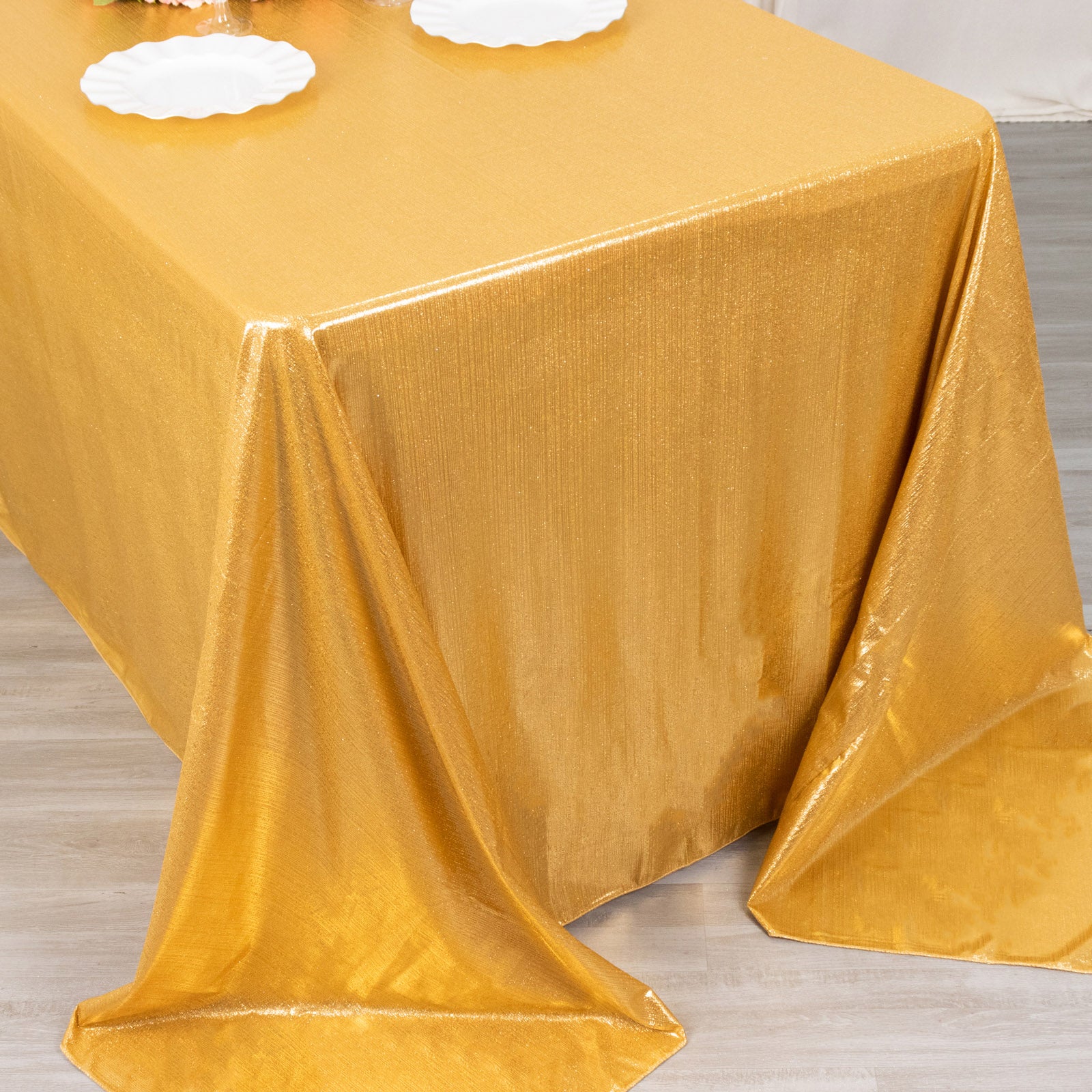 Gold shimmer sequin tablecloth, wrinkle-free glitter tablecover for festive occasions.