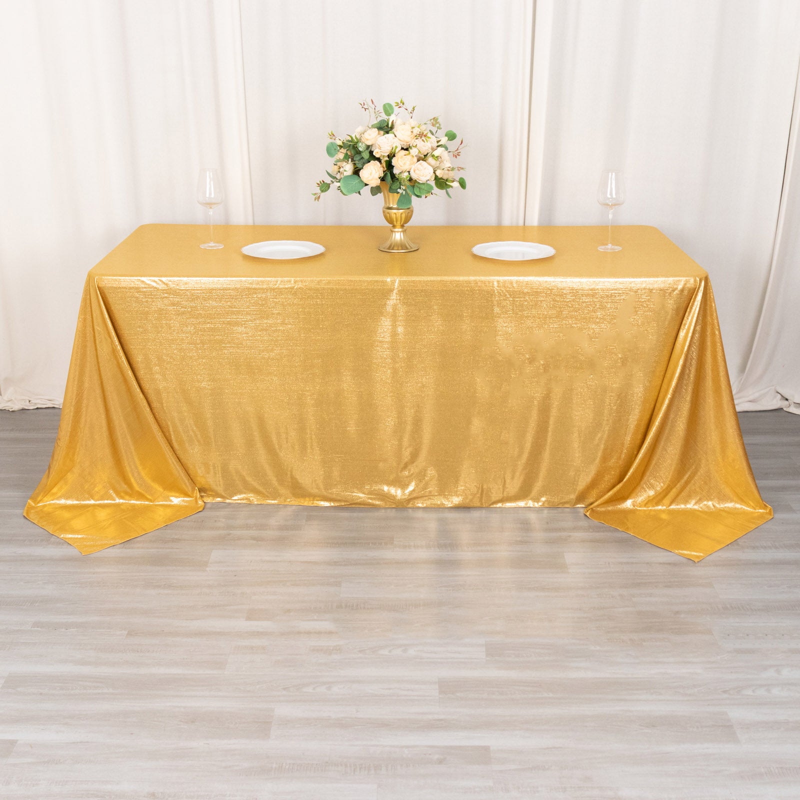 Gold shimmer sequin tablecloth with a sparkling finish for elegant events.