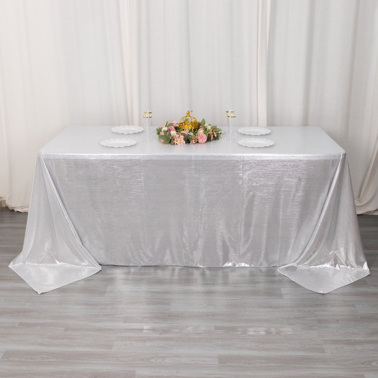 Silver shimmer sequin tablecloth on a decorated table.