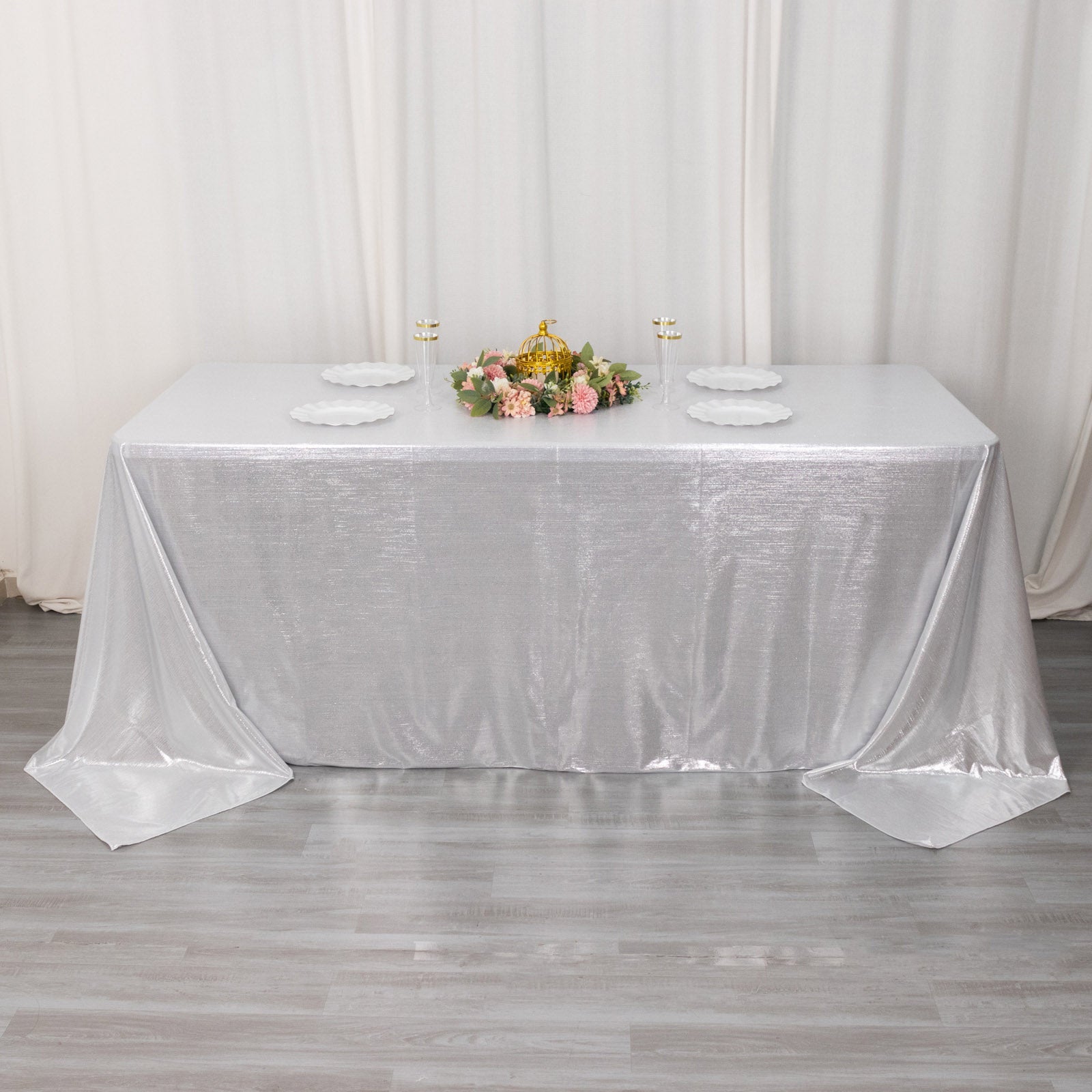 Silver shimmer sequin tablecloth on a decorated table.