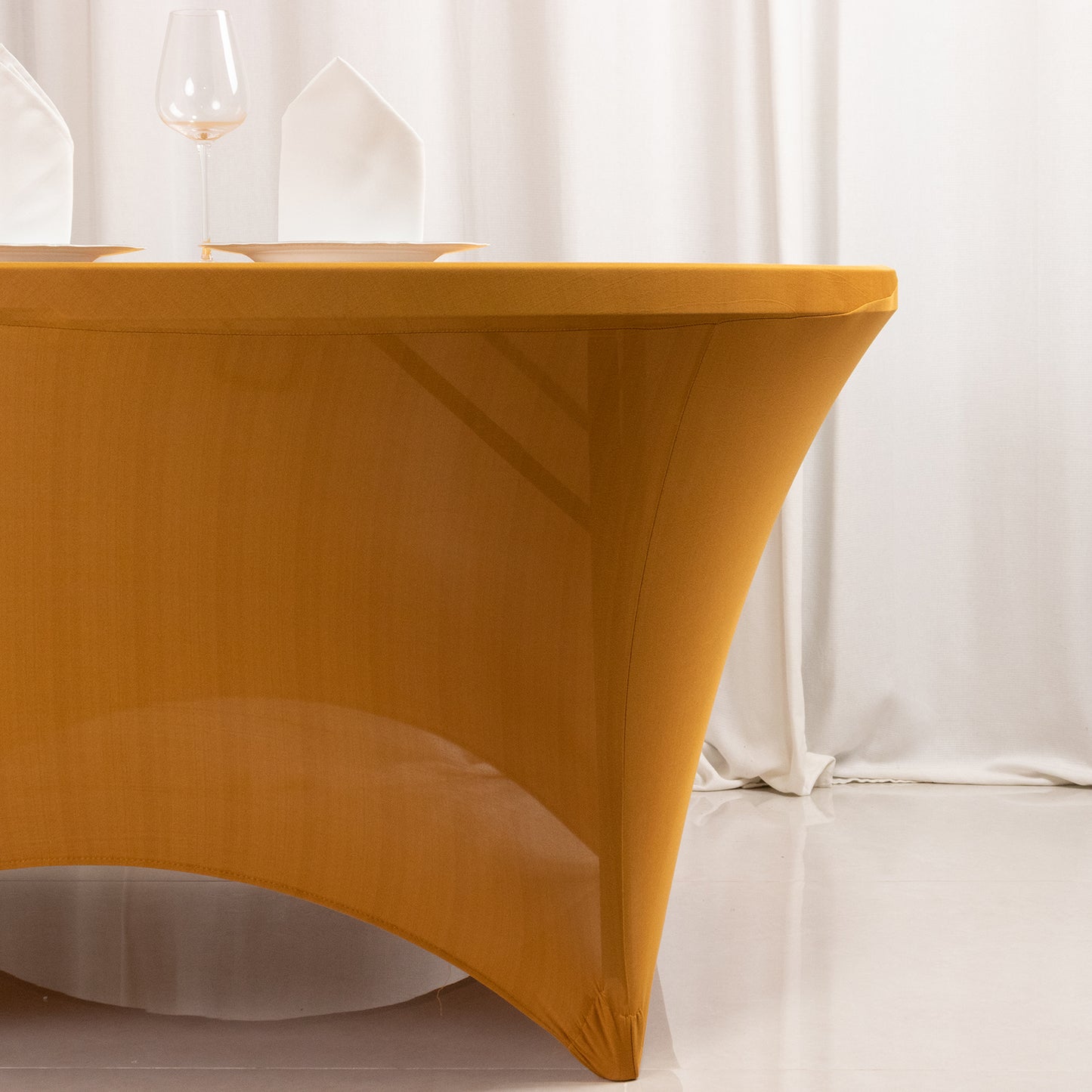 Gold stretch spandex fitted tablecloth for 5-foot tables.