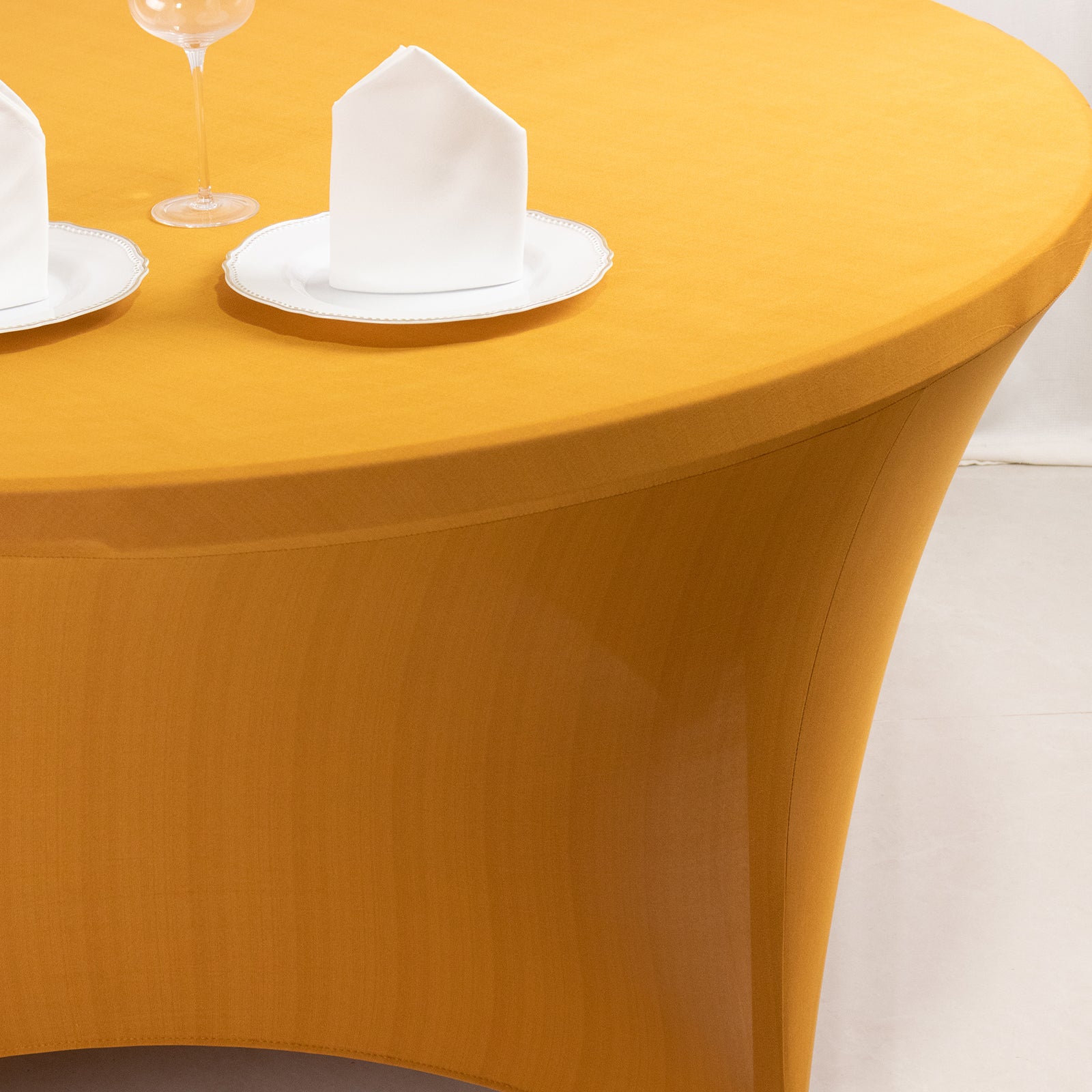Gold stretch spandex fitted tablecloth for 5-foot round tables.