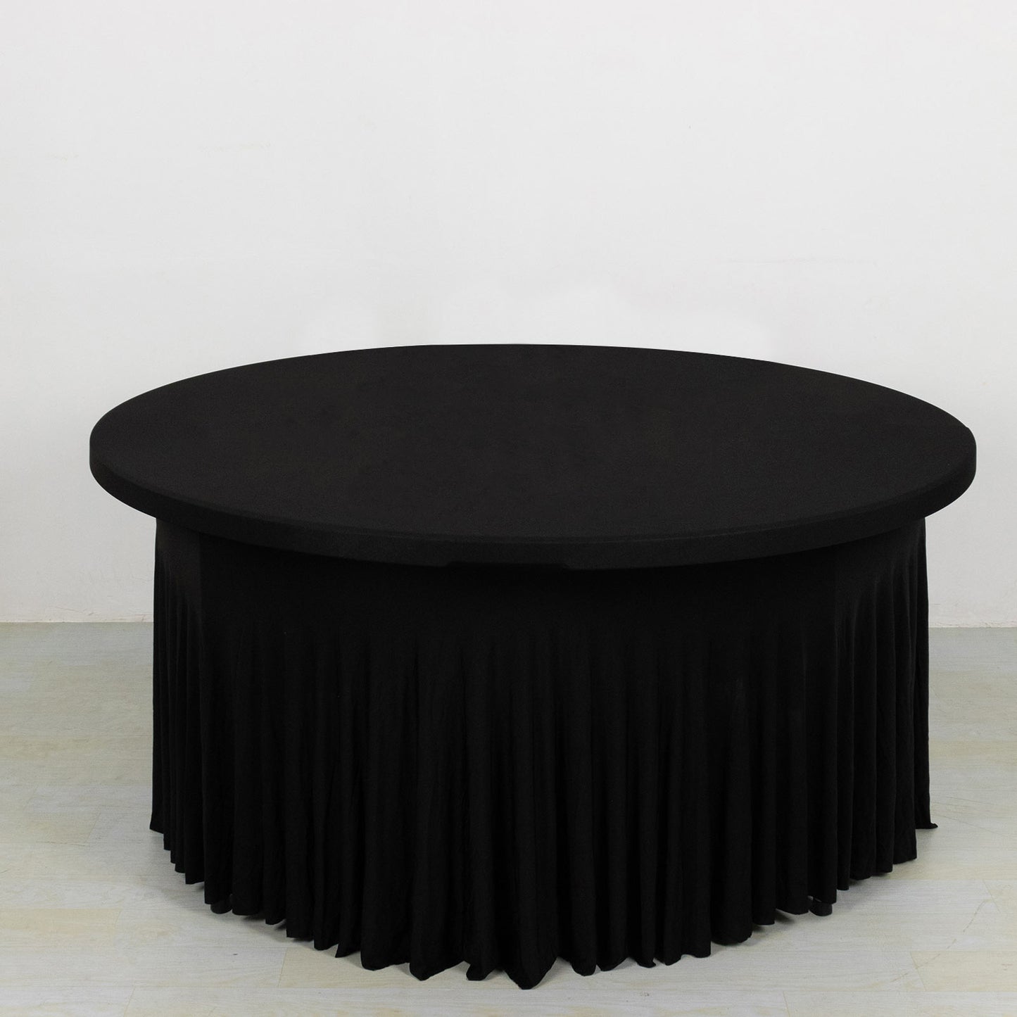 Black wavy spandex fitted tablecloth for 72-inch round tables.
