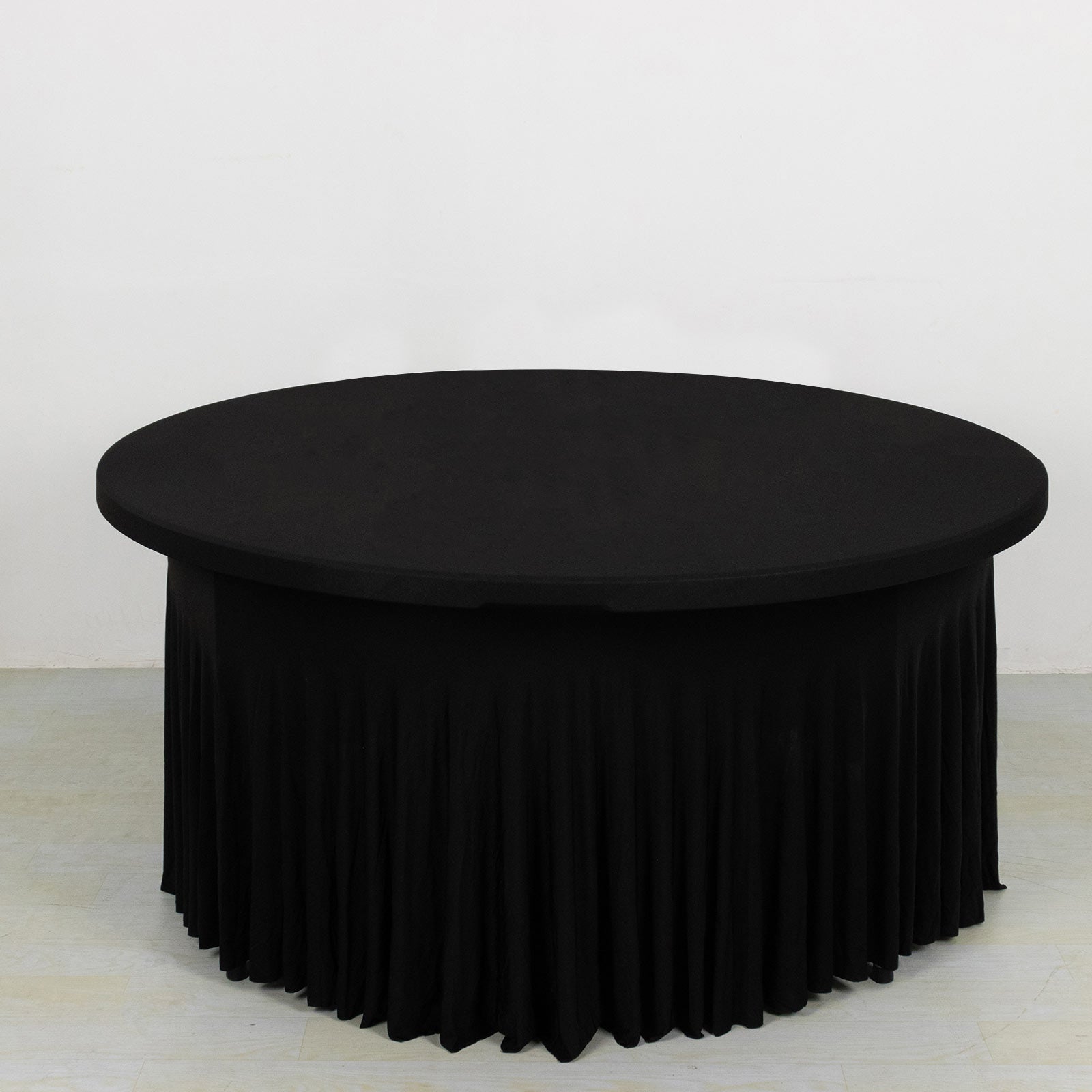 Black wavy spandex fitted tablecloth for 72-inch round tables.