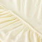 Ivory wavy spandex fitted tablecloth for 72-inch tables with ruffles.