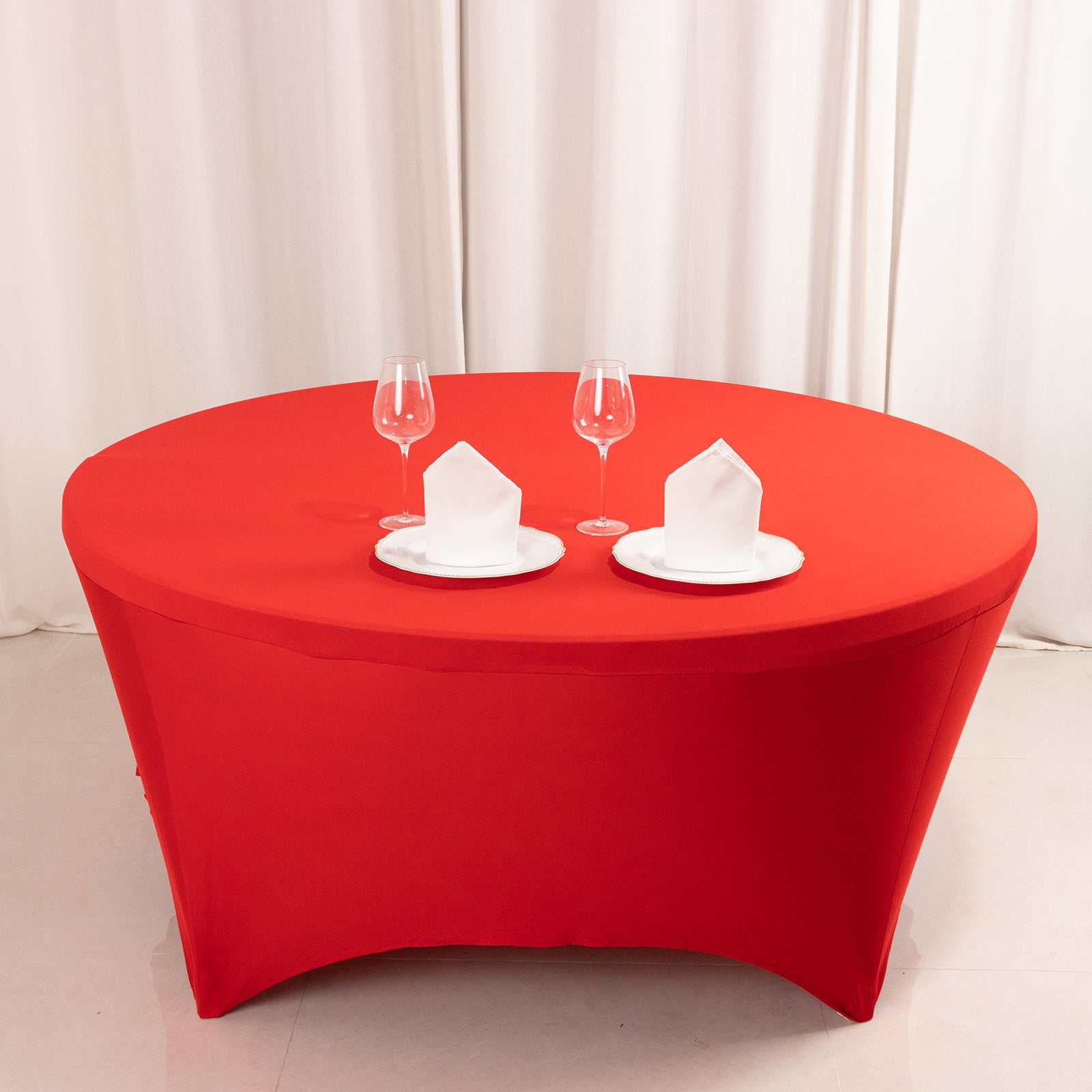 6ft red round stretch spandex tablecloth fitted for 72 inch tables.