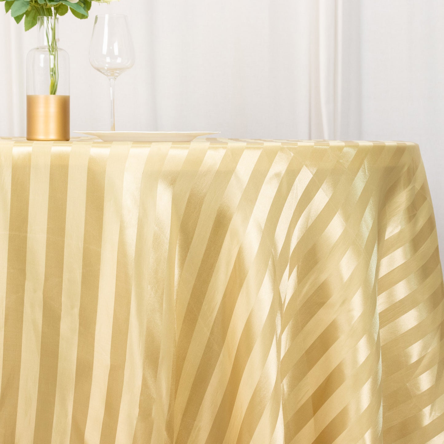 Champagne satin stripe seamless round tablecloth for elegant table settings.