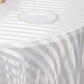 White satin stripe seamless round tablecloth on a table.