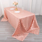 Dusty rose satin stripe tablecloth on a dining table.