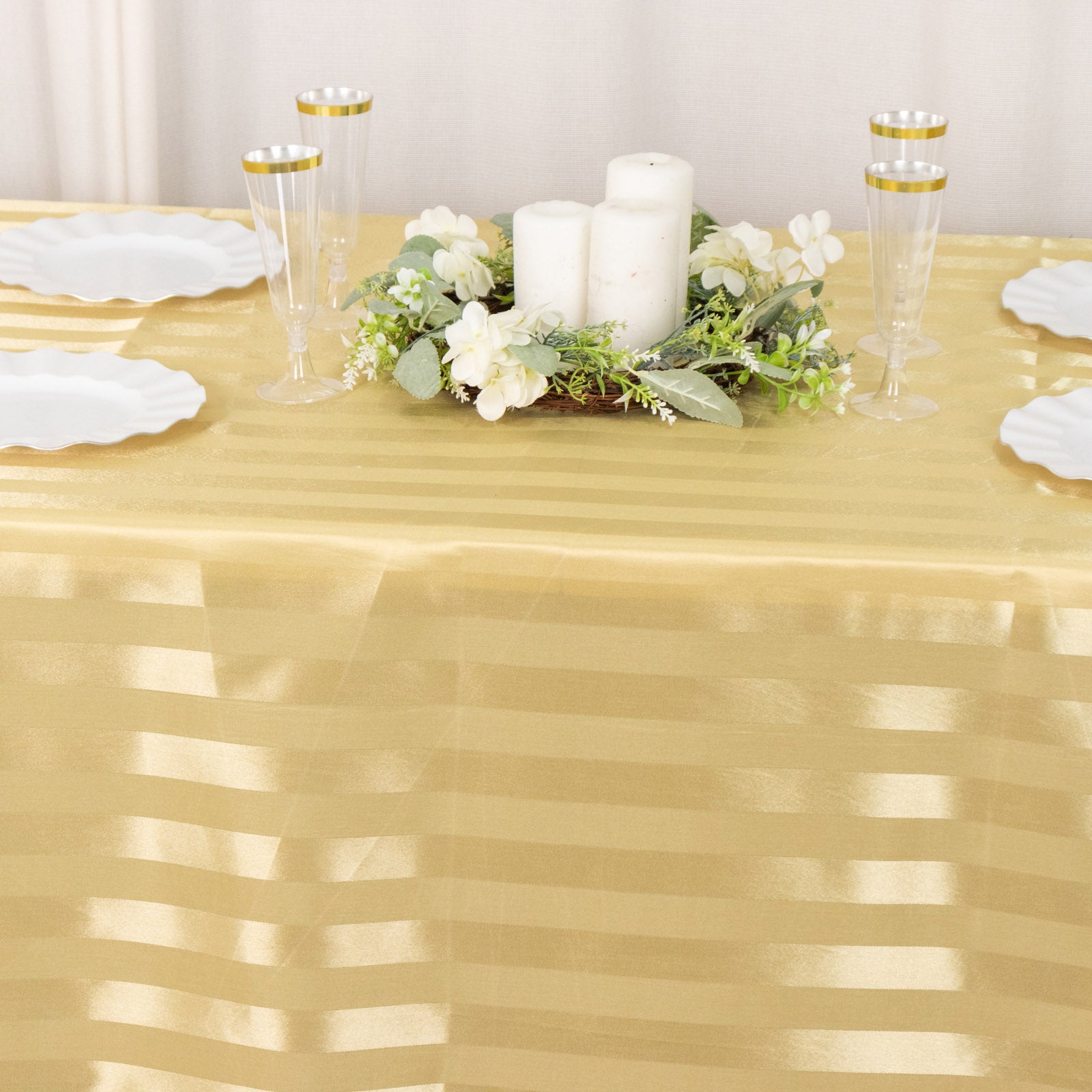 Champagne satin stripe seamless rectangular tablecloth on a table.