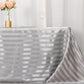 Silver satin stripe seamless rectangular tablecloth on a table.