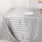 Silver satin stripe rectangular tablecloth on a dining table.