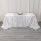 White satin stripe tablecloth on a rectangular table.
