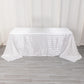 White satin stripe tablecloth on a rectangular table.