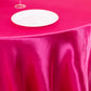 Fuchsia satin round tablecloth for 6-foot table with floor-length drop.