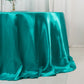 Turquoise satin round tablecloth for 6-foot table with floor-length drop.