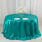 Turquoise satin round tablecloth for 6-foot table with floor-length drop.