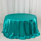 Turquoise satin round tablecloth for 6-foot table with floor-length drop.