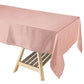 Dusty rose seamless satin rectangular tablecloth on a wooden table.