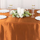 Cinnamon brown satin rectangular tablecloth with elegant table setting.
